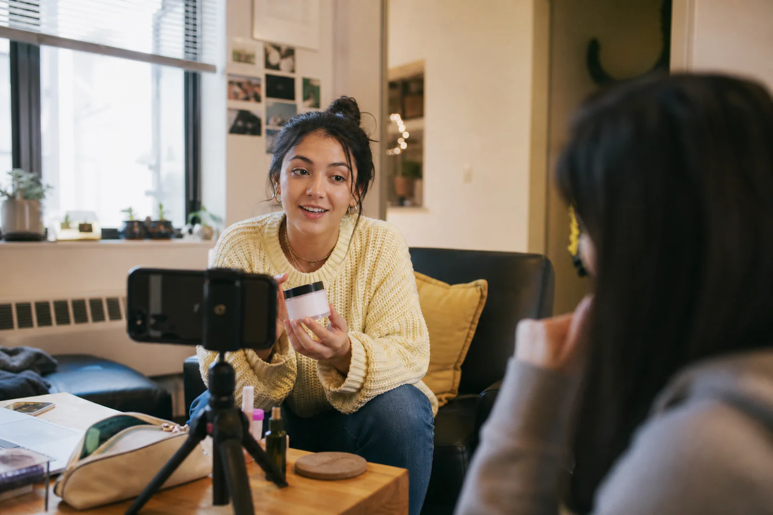Student creator filming an authentic product demonstration in a campus residence